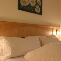 Zimmer_Bett © Gästehaus Kirschgarten Zimmer_Bett © Gästehaus Kirschgarten