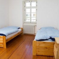 Schlafzimmer Ap. 3 © Gästezimmer Mittelgasse Schlafzimmer Ap. 3 © Gästezimmer Mittelgasse