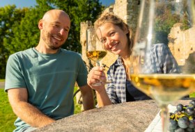 Rest in greenery with wine couple