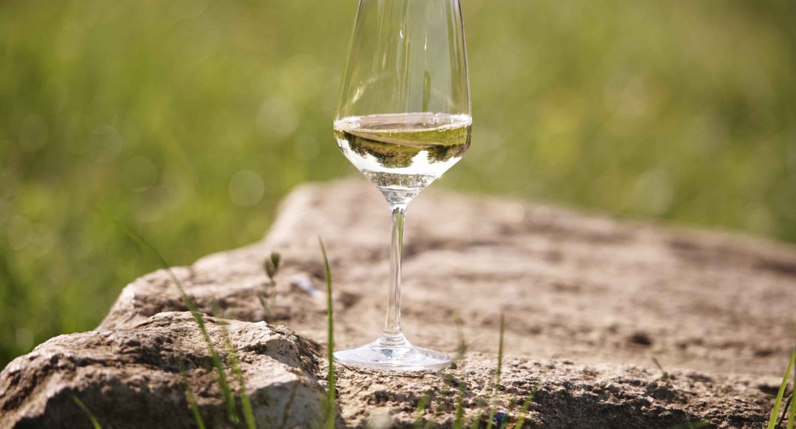 White wine glass on stone, © Robert Dieth